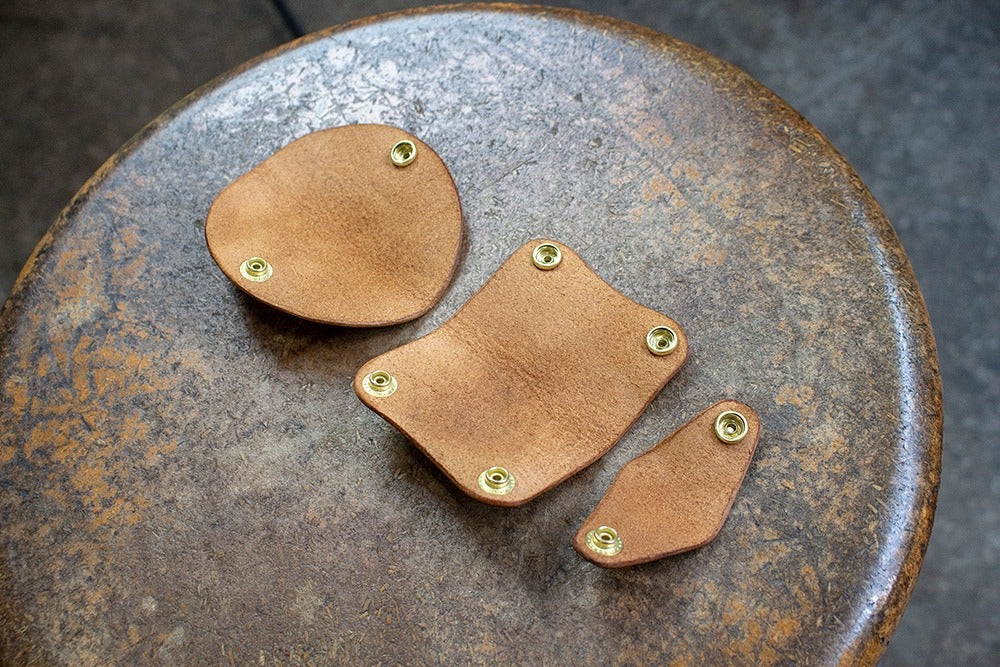 A pattern for 3 simple leather headphone holders